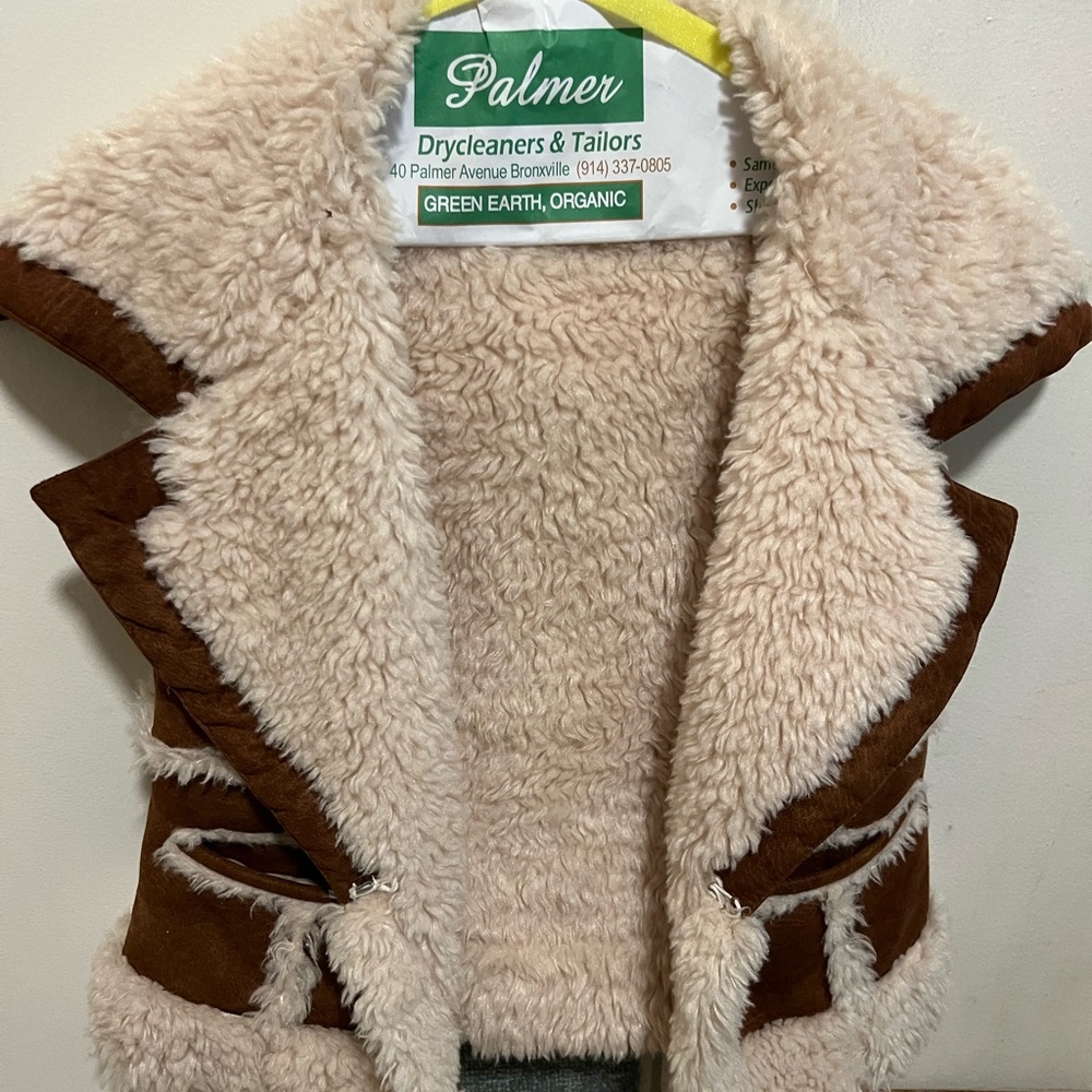 Fleece-lined suede Western style vest.